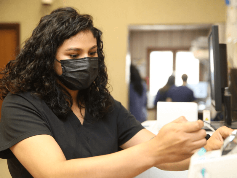 Veterinary staff wearing a black face mask